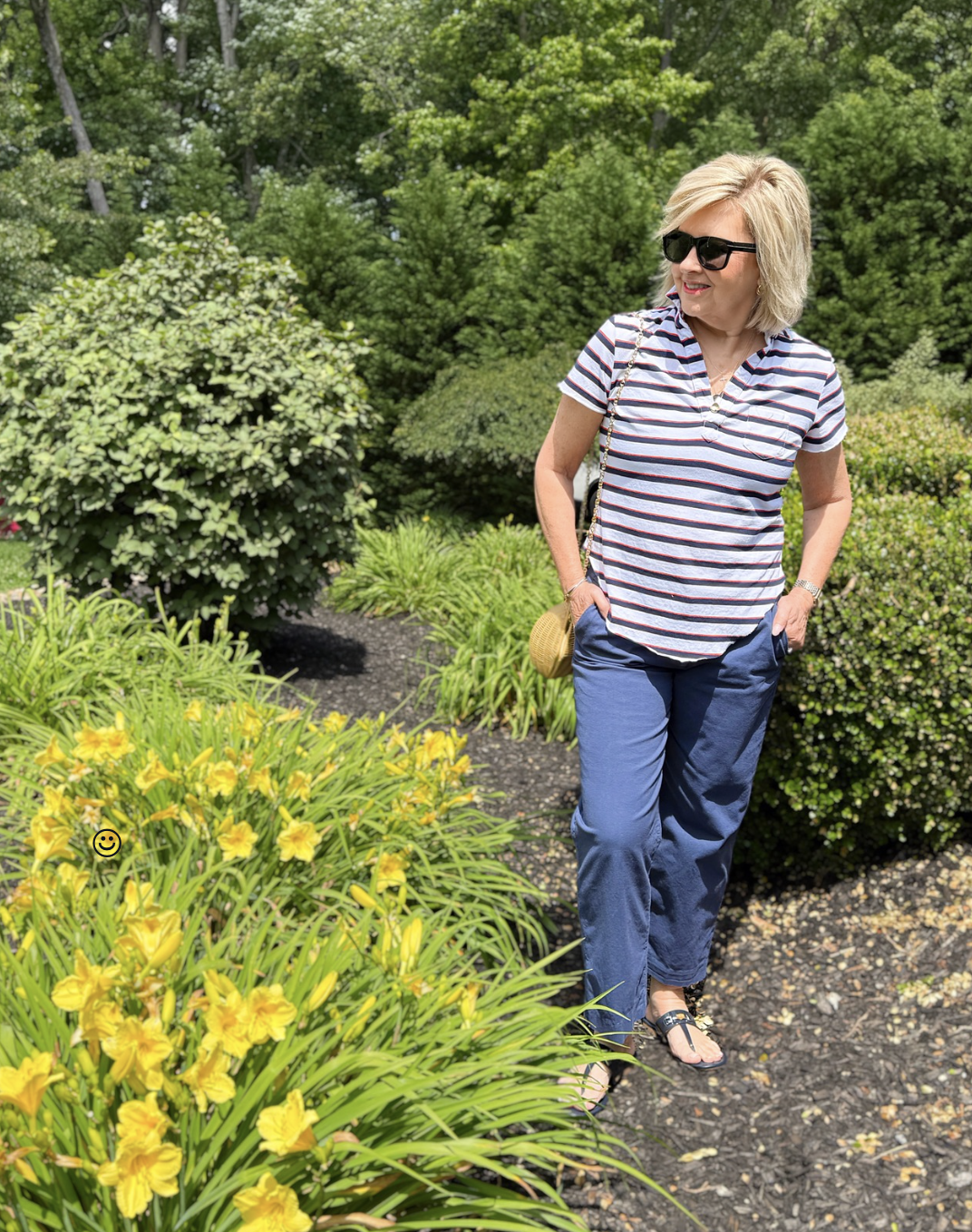 Tania Stephens wearing navy pants and a red, white, & blue striped shirt  